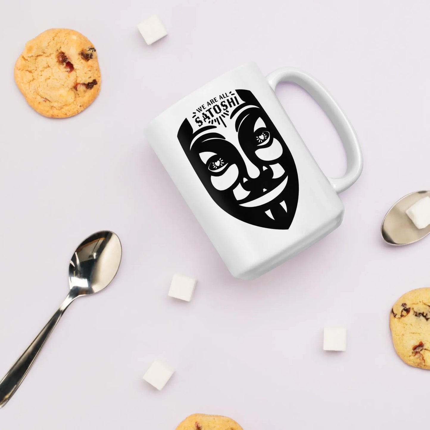 bitcoin mug - fawkes we are all satoshi - surrounded by cookies view