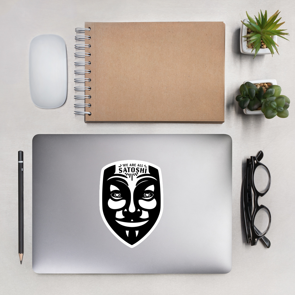 bitcoin sticker - fawkes - applied on laptop in office surrounding