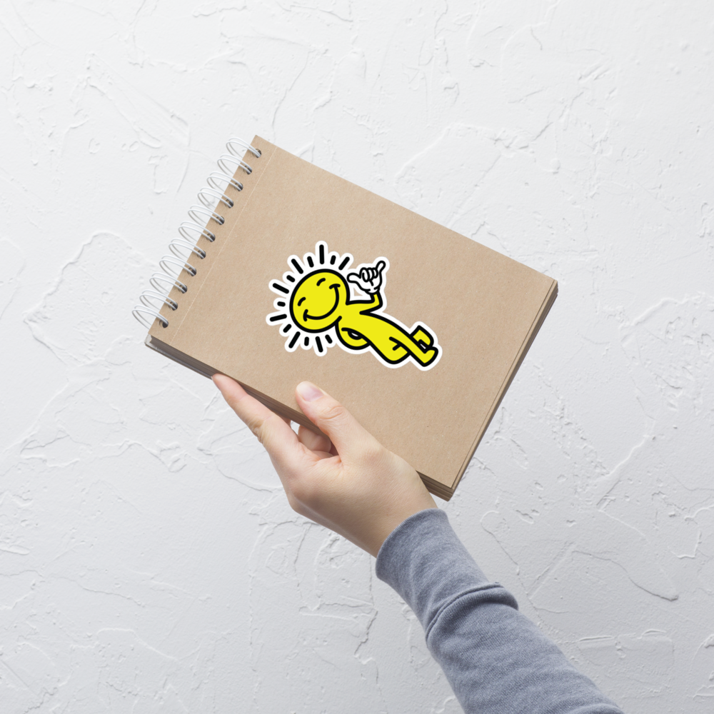 smiling sun sticker - applied on notebook